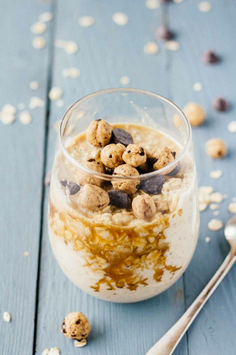 Chocolate Chip Cookie Dough Overnight Oats served in a glass on a wooden surface
