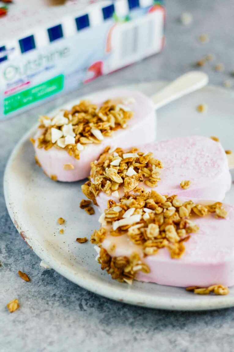 A side shot of strawberry frozen yogurt bars on a plate