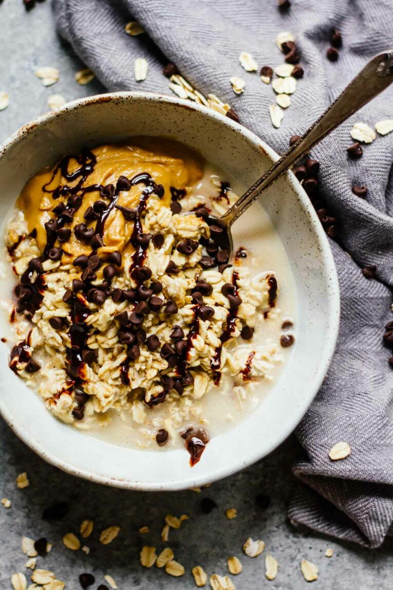 Chocolate Peanut Butter Overnight Oats served in a bowl with a spoon.