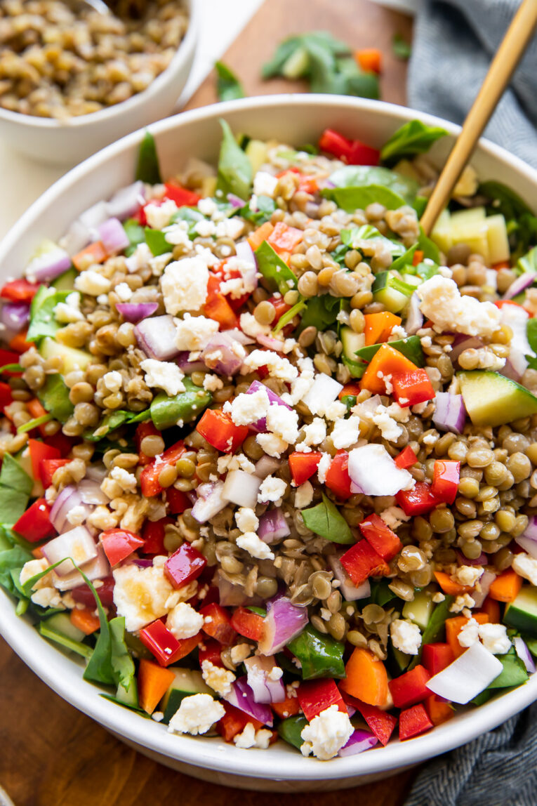 BEST Lemon Balsamic Lentil Salad with dressing being drizzled over top.