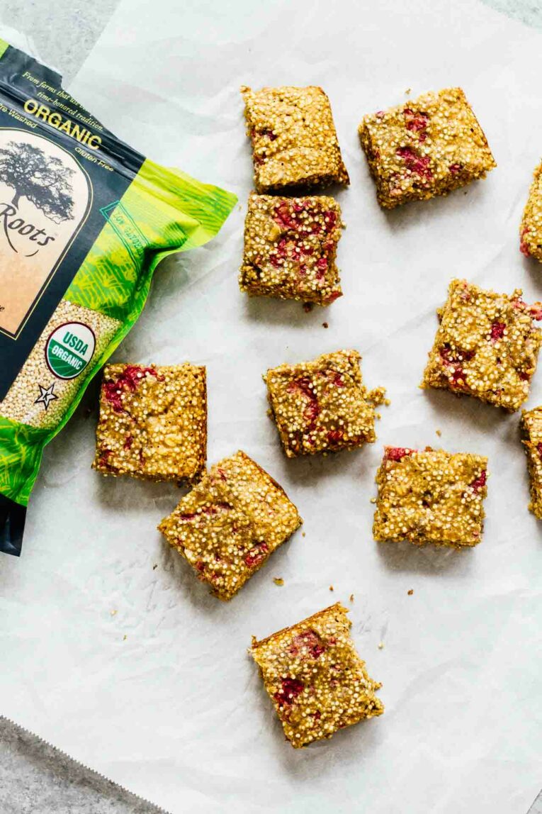Overhead shot of  Raspberry Breakfast Quinoa Bars with bag of truROOTS 100% Whole Grain Quinoa!