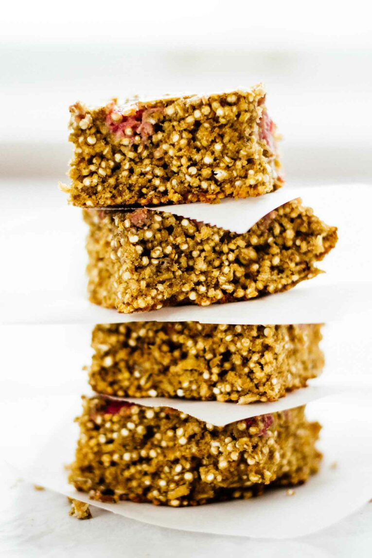 4 Raspberry Breakfast Quinoa Bars stacked on top of each other