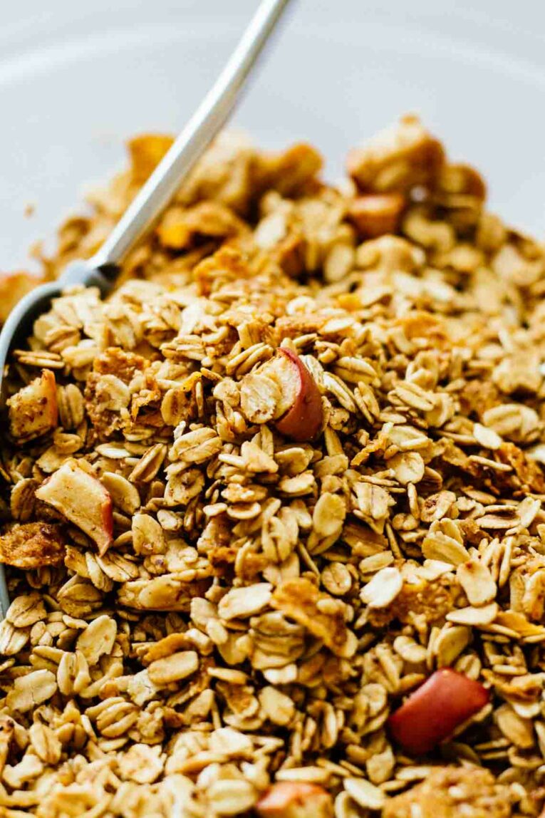 Toasted Granola with Baked Apple Chunks and a Spoon