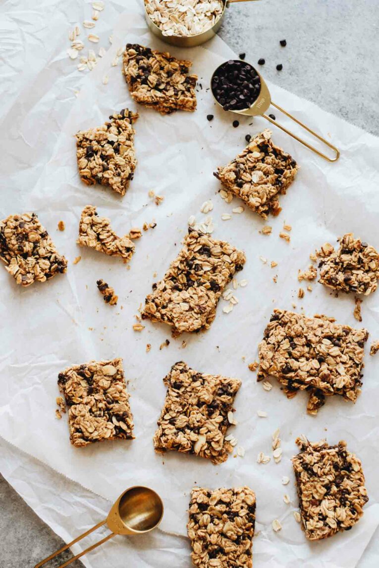 The BEST Baked Oatmeal Breakfast Bars scattered on parchment paper