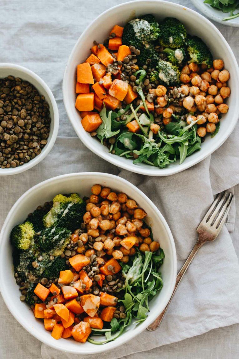 Vegan Chickpea & Sweet Potato Bowls with broccoli, lentils, and arugula.