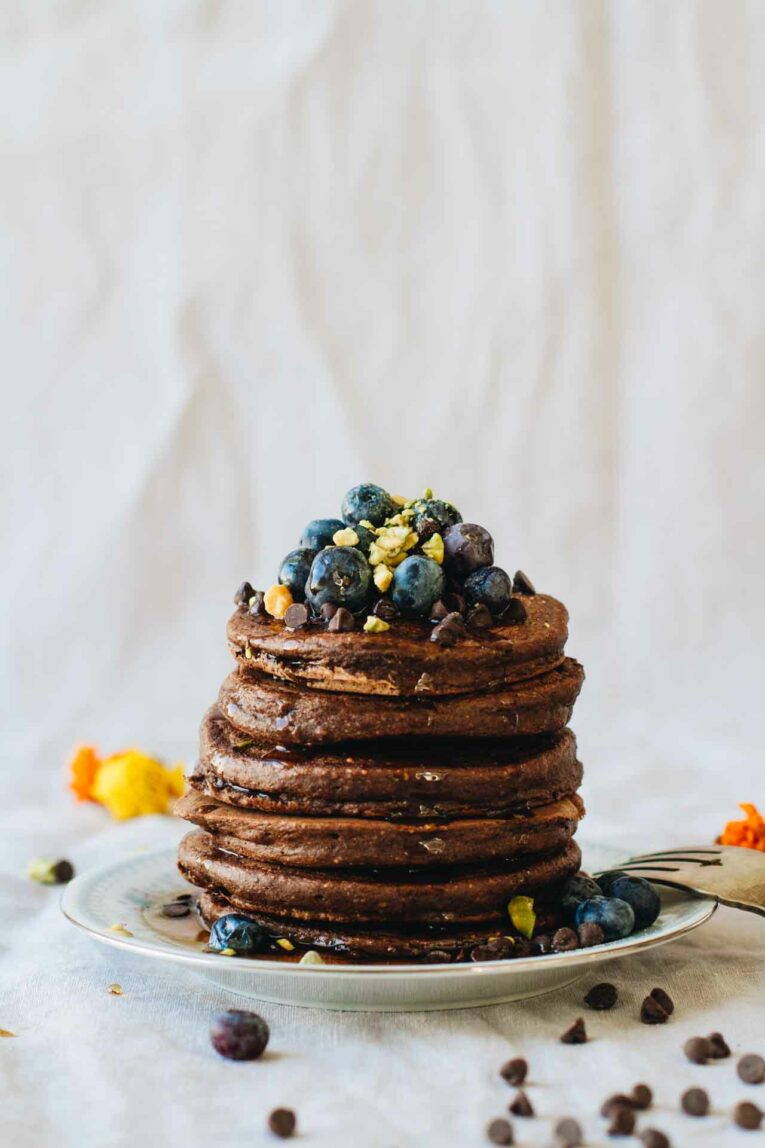 Chocolate Protein Pancakes! Loaded with superfoods, protein, fruit, eggs, and rolled oats. They also happen to be gluten and dairy free!