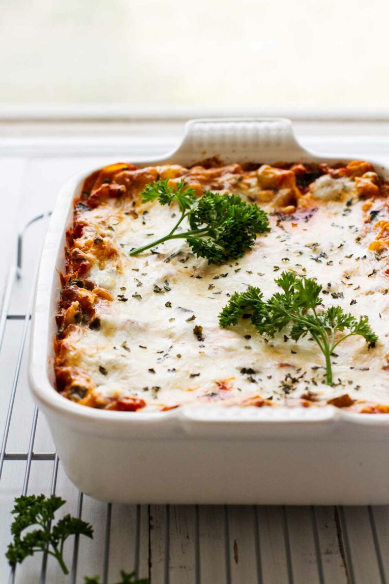 The BEST Easy Healthy Lasagna Recipe across on a table with window in the background.