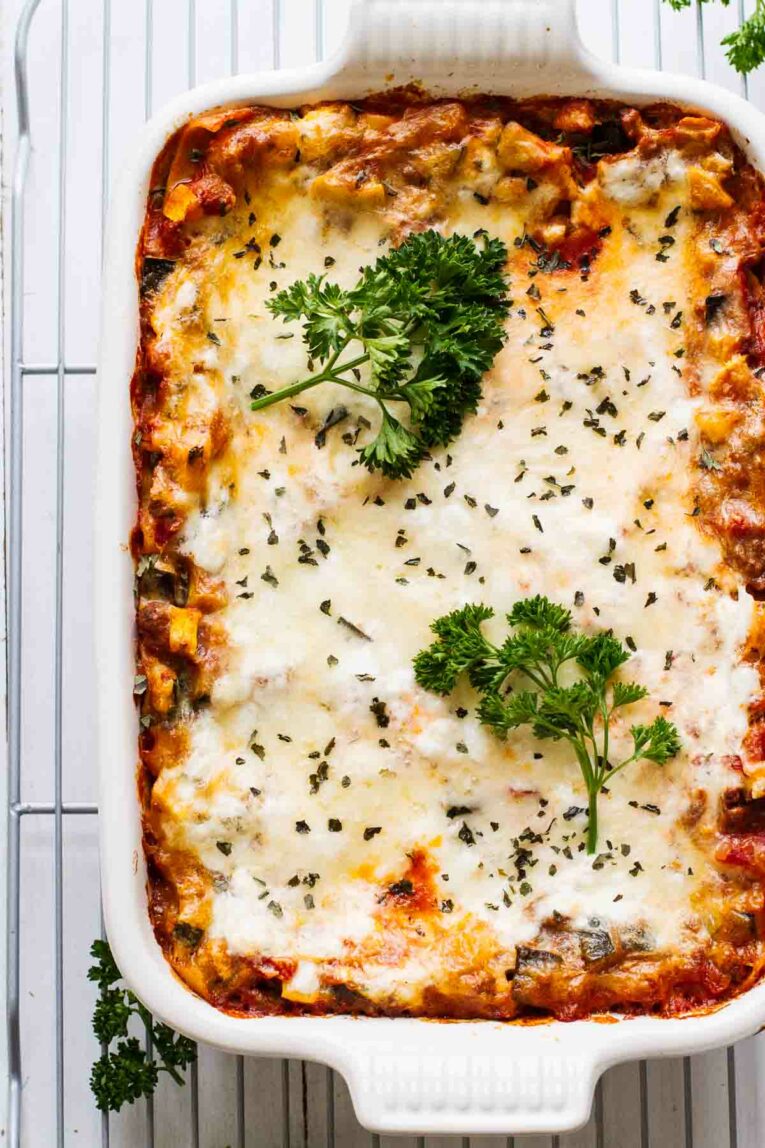 Overhead shot of The BEST Easy Healthy Lasagna Recipe in a white baking dish on a cooling rack.