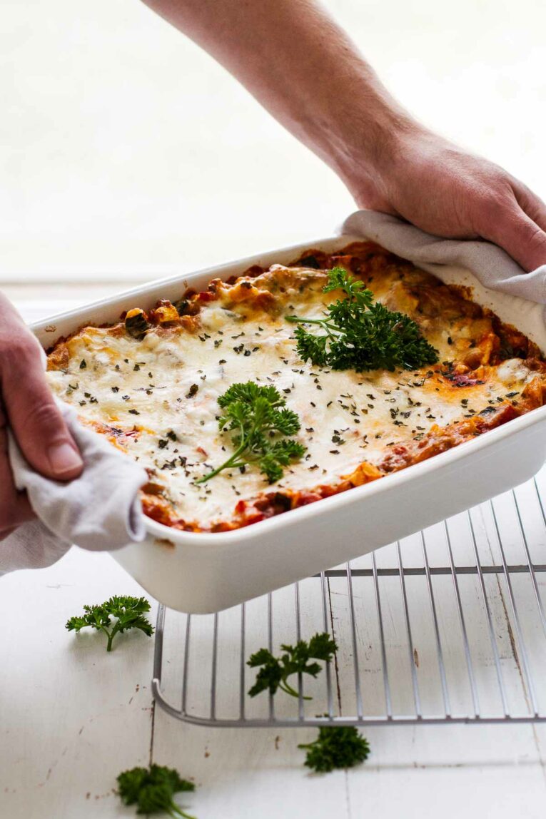 The BEST Easy Healthy Lasagna Recipe being placed on a table.