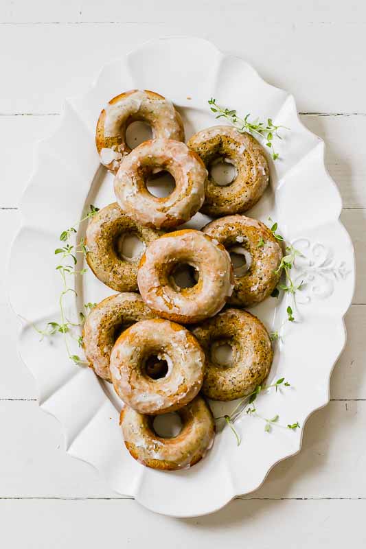 Overhead shot of Lemon Poppyseed Healthy Baked Donuts on a white serving dish!