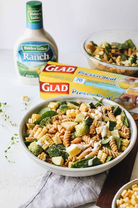 Barbecue Ranch Pasta Salad in a bowl with hidden valley ranch and glad press n' seal
