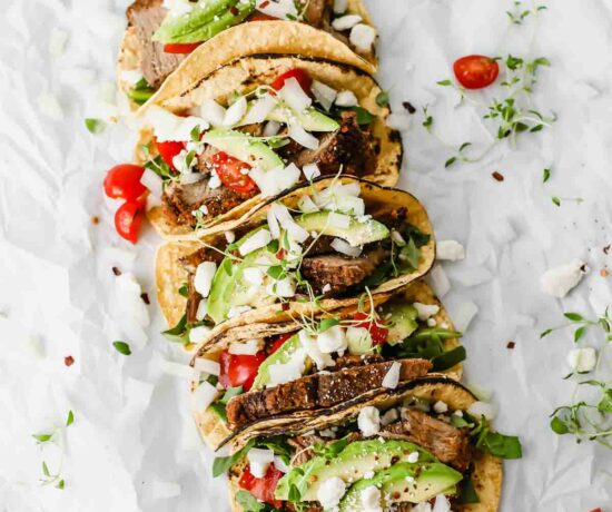 Easy Mexican Barbacoa Tacos by Jar Of Lemons! Corn tortillas topped with slow cooked chuck roast beef, avocado, tomatoes, onions, and feta cheese. So yummy!