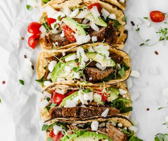 Easy Mexican Barbacoa Tacos by Jar Of Lemons! Corn tortillas topped with slow cooked chuck roast beef, avocado, tomatoes, onions, and feta cheese. So yummy!