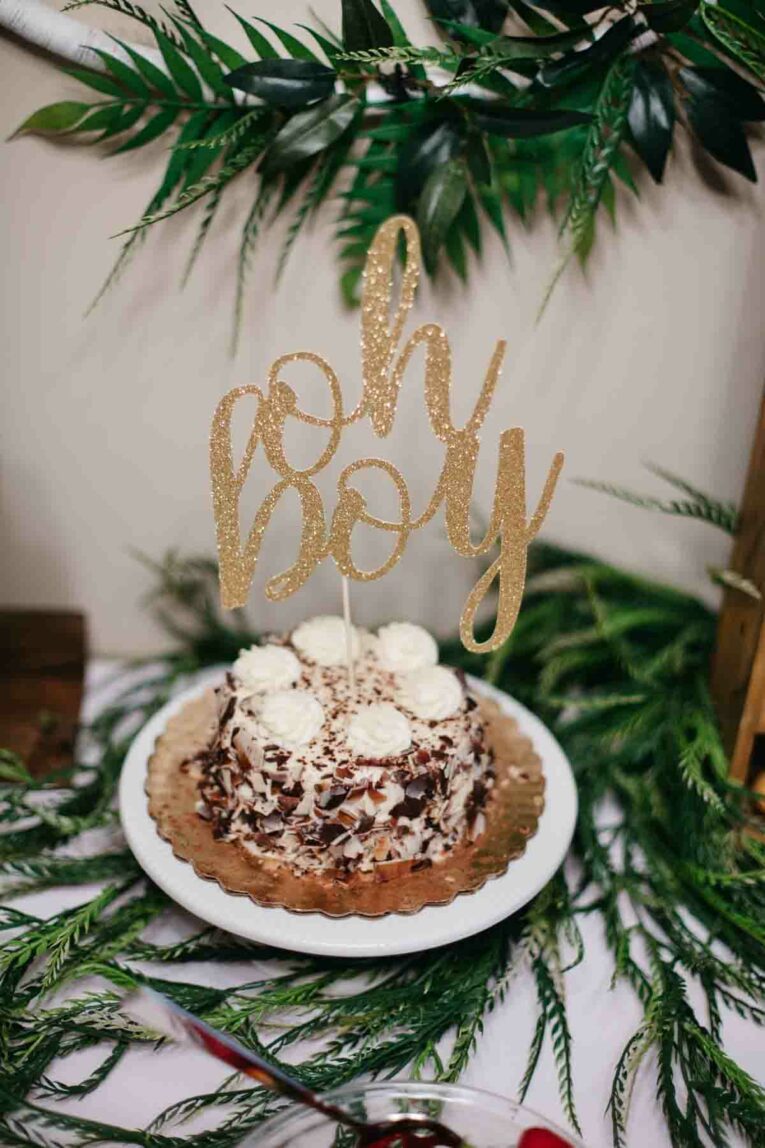 Oh Boy sign over small cake.
