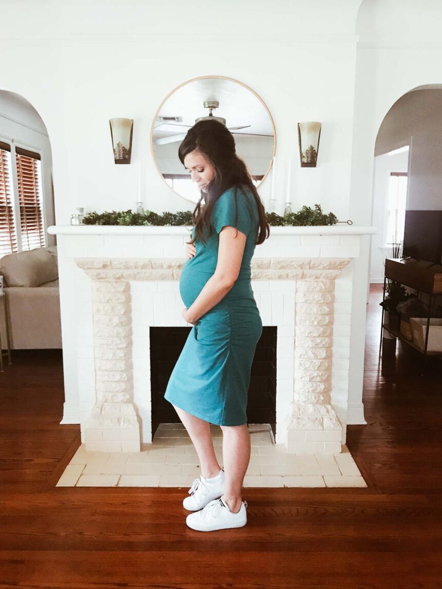 Girl showing baby bump at 30 Weeks