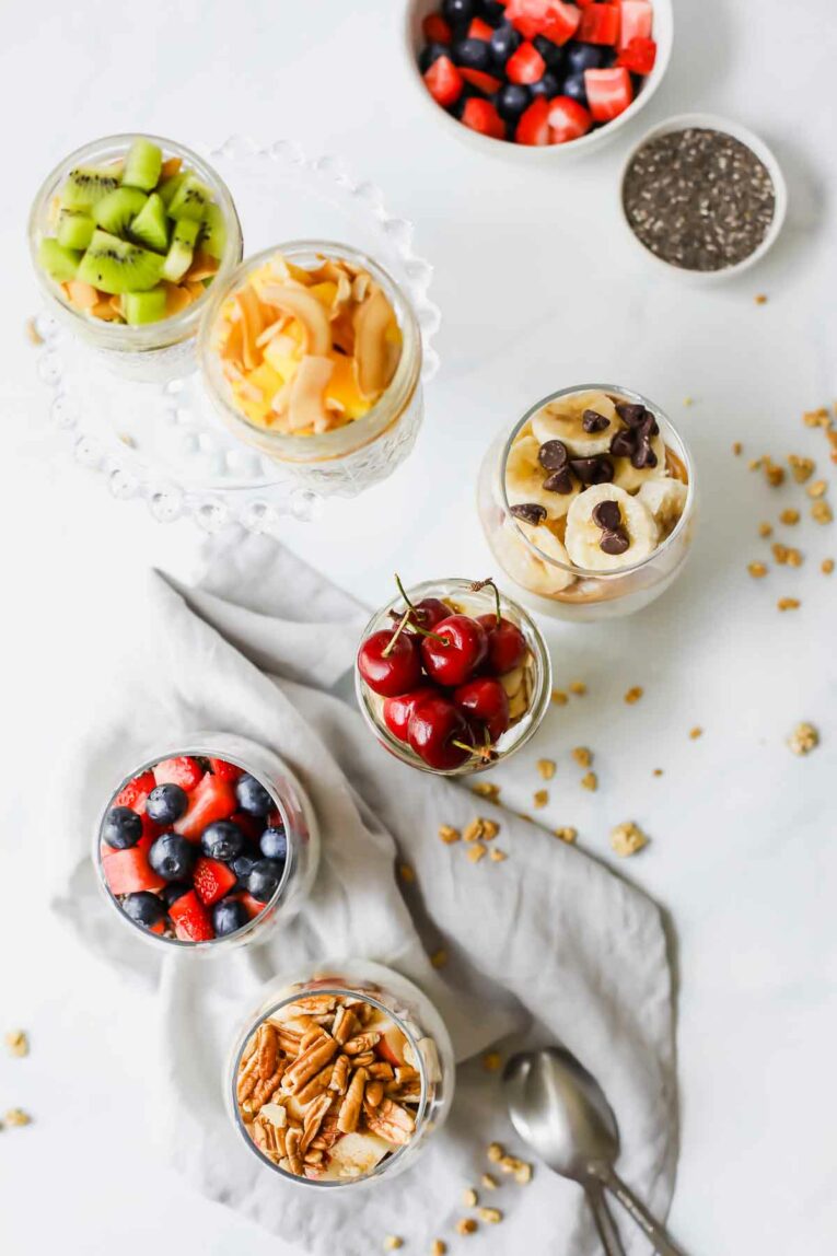 Top shot of Protein-Loaded Yogurt Parfait Recipes on a white background with a grey napkin