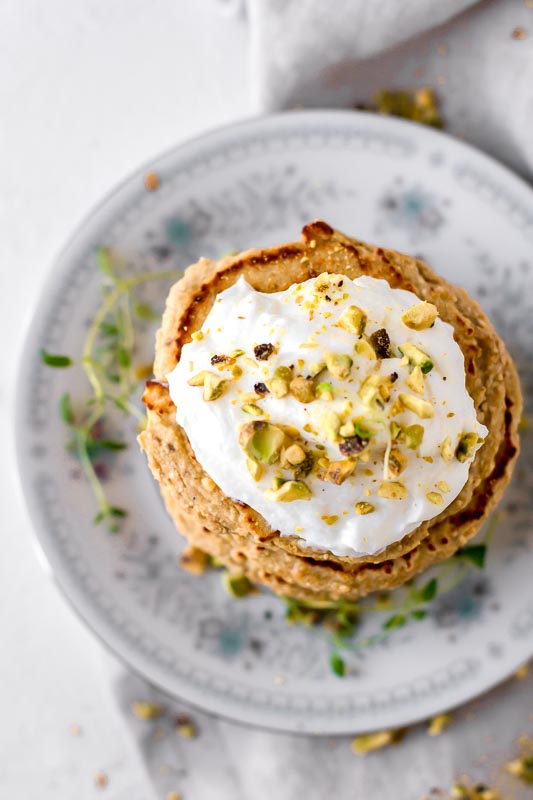 Overhead shot of Simple 3-Ingredient Protein Pancakes  on a floral plate.