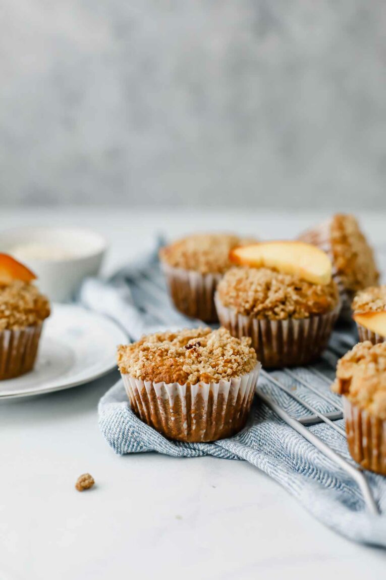 Wholesome Peach Muffins on a cooling rack.