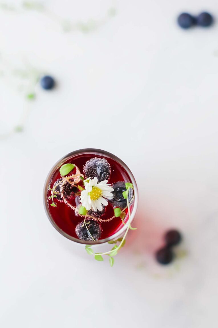 Overhead shot of  Blueberry Thyme Mimosa in a glass.