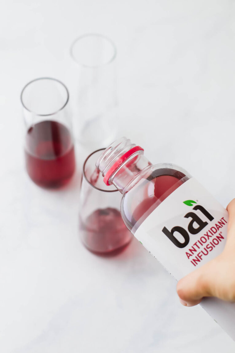Bai Antioxidant Blueberry Flavor being poured into glass.