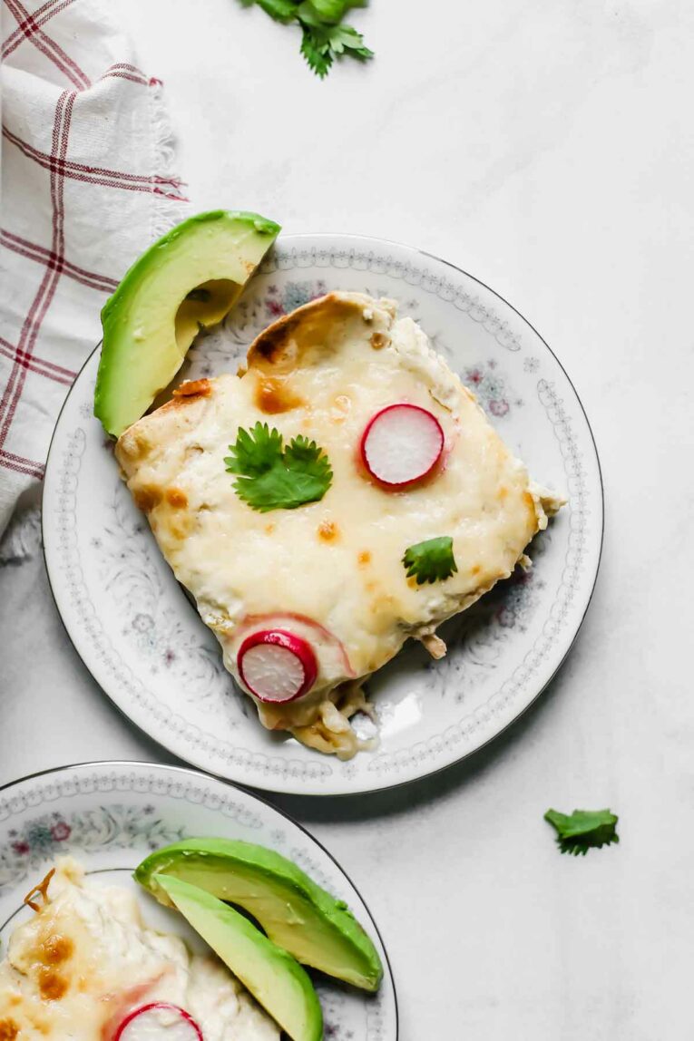 Skinny Creamy Chicken Enchiladas served on a small plate.