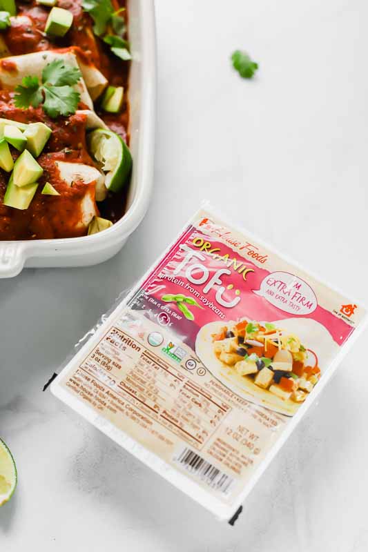 House Foods Organic Firm Tofu next to enchilada dish