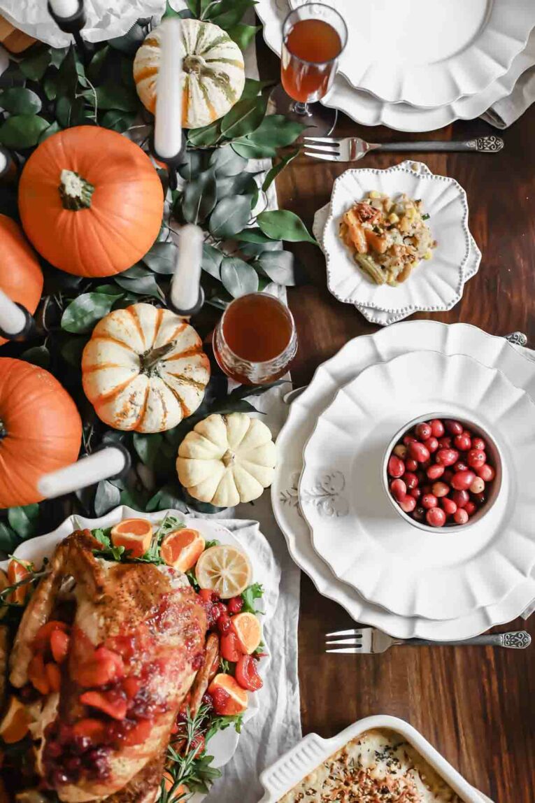 The BEST Citrus Tea-Glazed Roasted Turkey on a table set for Thanksgiving.