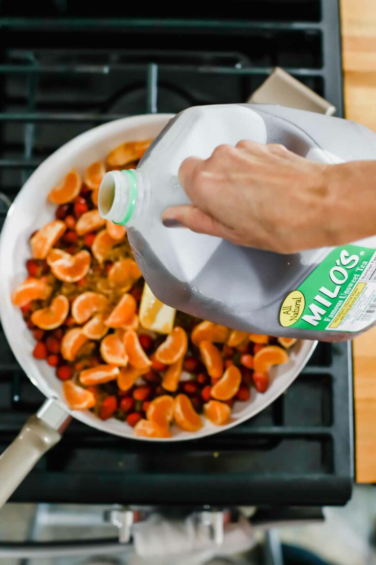 Milo's tea being poured into skillet.