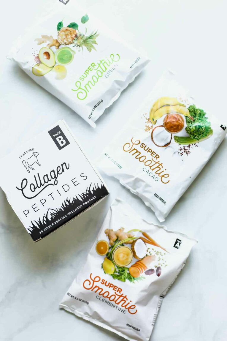 Easy Breakfasts w/ Smoothie Box (Honest Review) Smoothie box smoothie packs and collagen peptides on a white marble table top.