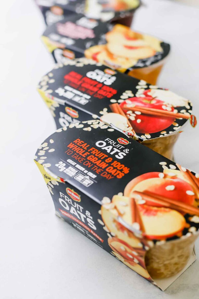 Del Monte fruit and oats containers on a countertop.