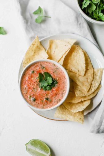 A top shot of a bowl of tomato salsa.