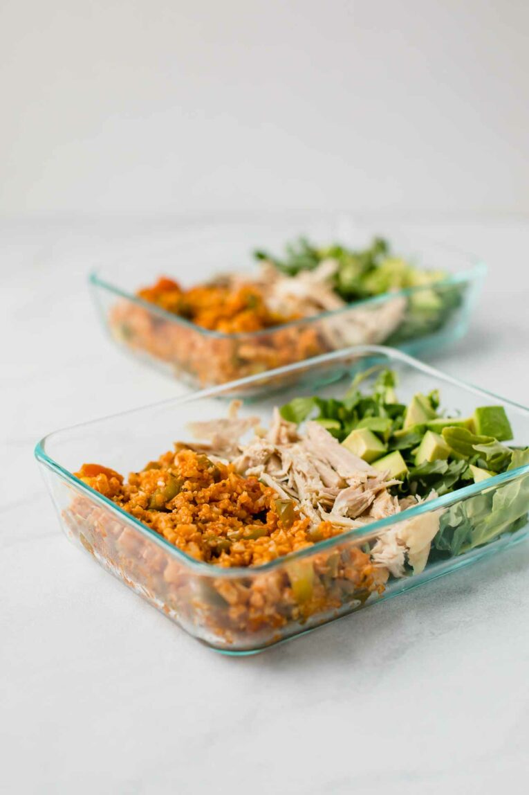 Side shot of Low-Carb Mexican Meal Prep Bowls on a white countertop.