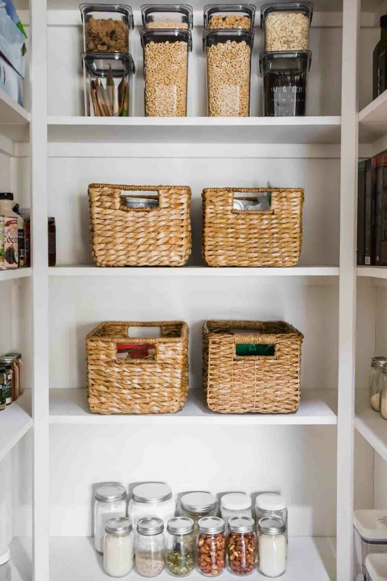 Beautiful, organized pantry with baskets, containers, and mason jars.