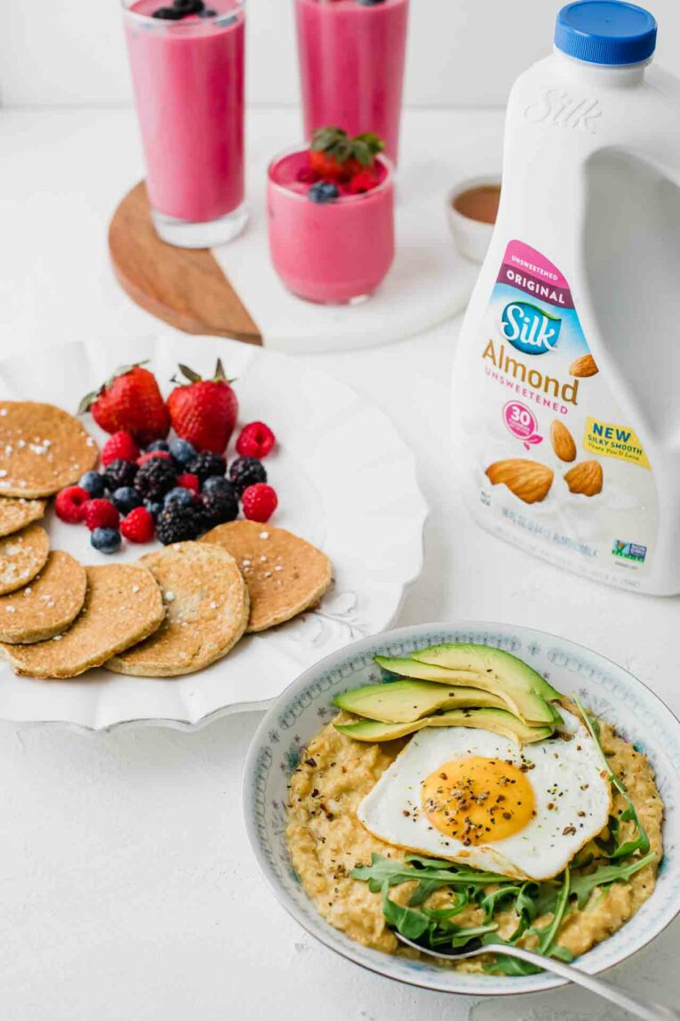 Nutritious breakfast favorites on a table with Silk Almondmilk.