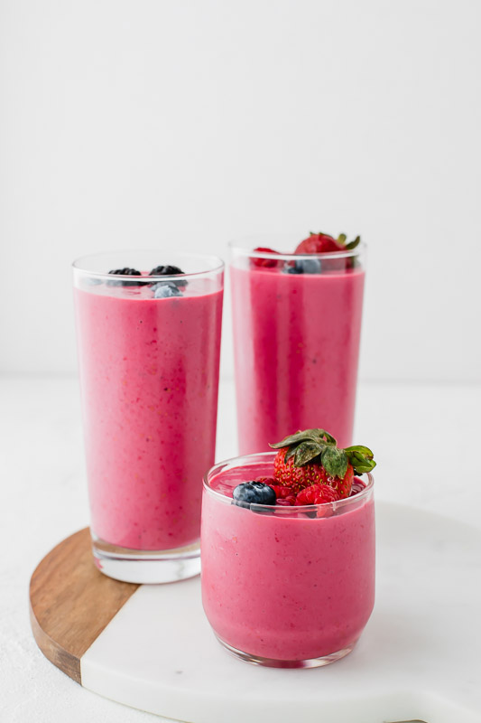 3 Berry Breakfast Smoothies on a platter.