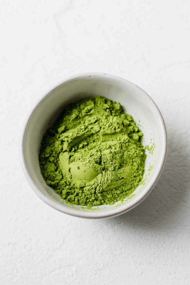 Need an afternoon pick-me-up? This 5-Minute Iced Green Tea Matcha Latte is vegan, dairy-free, loaded with antioxidants, low in sugar, and delicious! Green Tea Matcha Powder used in an iced matcha latte recipe.