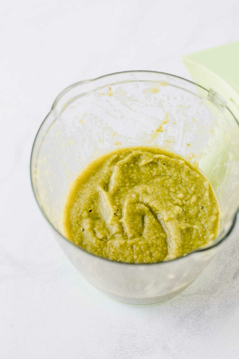 Asparagus baby food puree in a baby food maker.