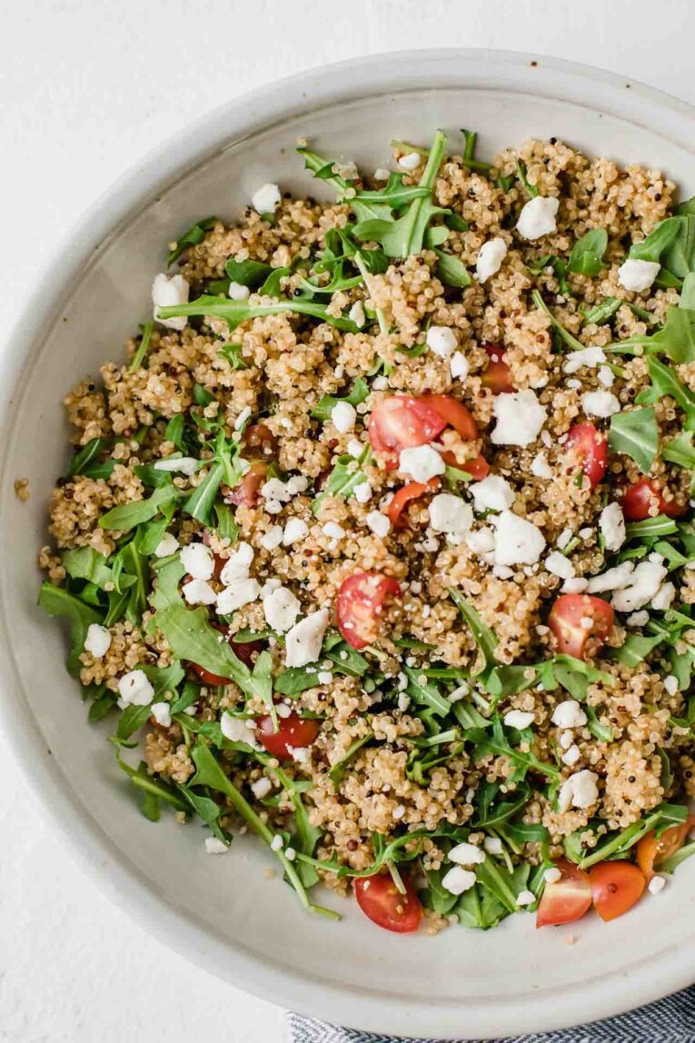 Easy Quinoa Salad with Feta Cheese in a large white bowl.