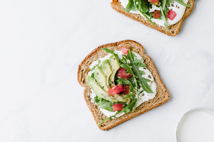 The BEST Avocado Toast on a white background.