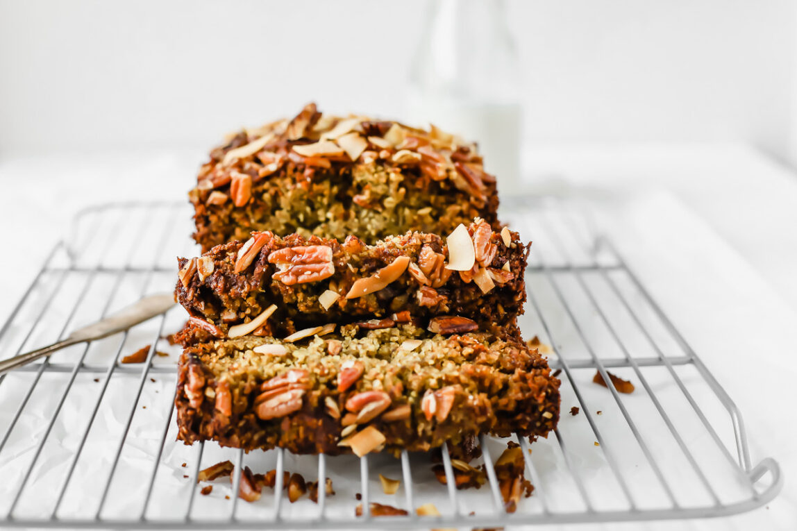 The BEST Vegan Zucchini Bread sliced on a baking rack.
