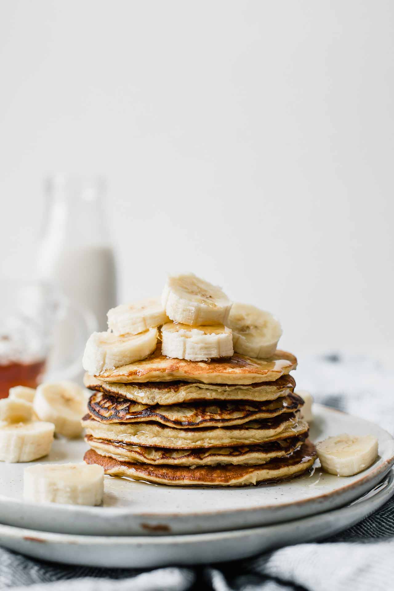  Stack of 10-Minute Healthy Banana Pancakes on a white plate.
