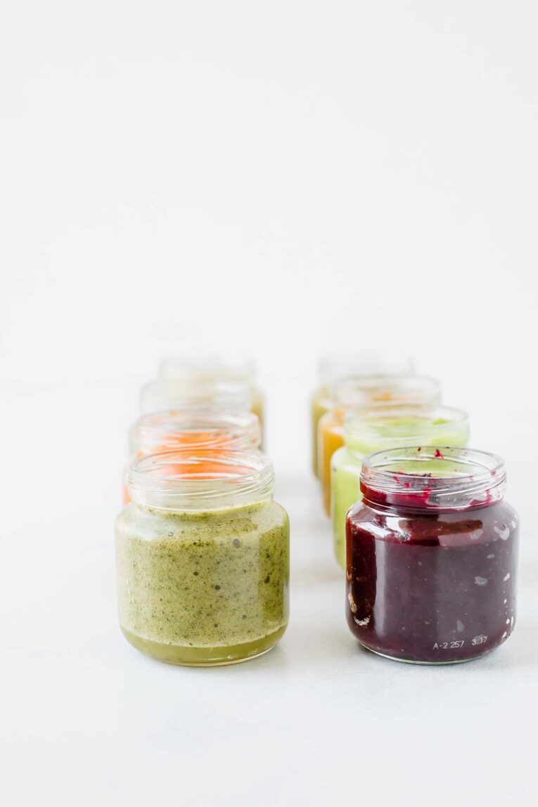 Baby food recipes pureed and stored in baby food containers.