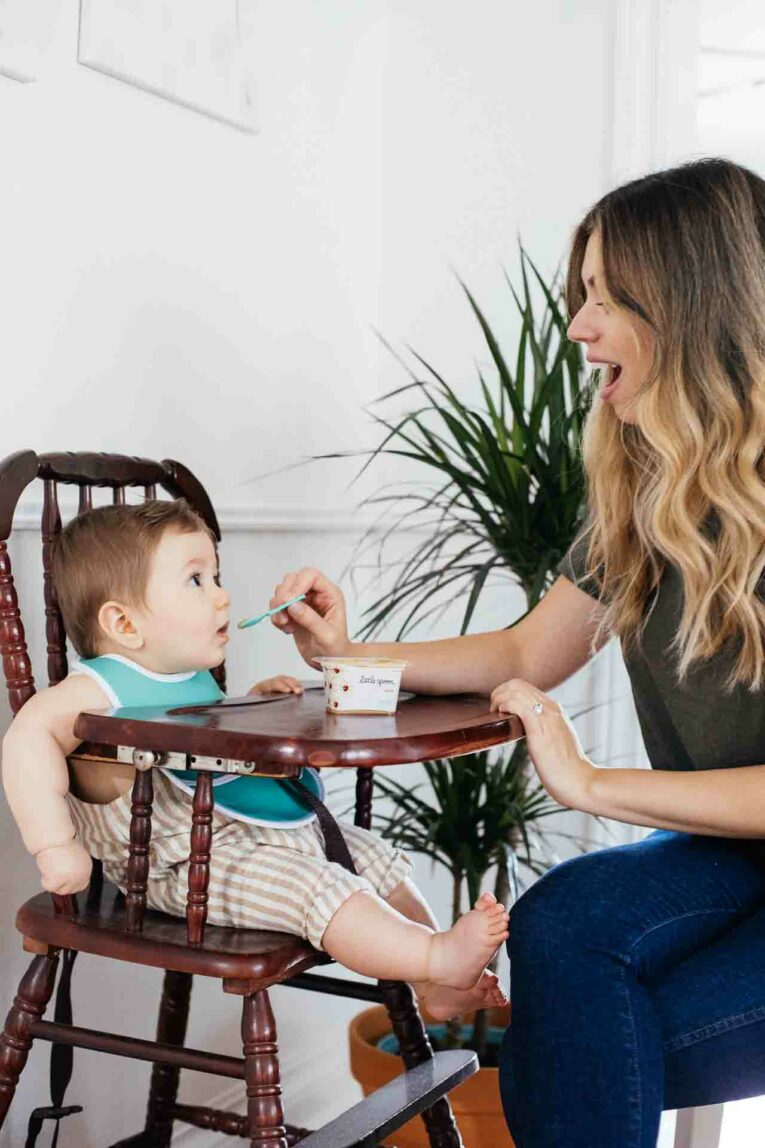 Mom feeding baby Little Spoon Organic Baby Food