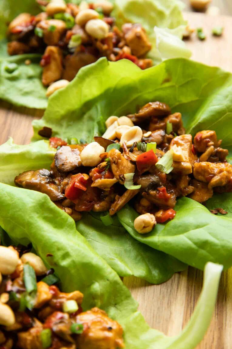 Thai chicken with peppers and green onions in a cabbage leaf.