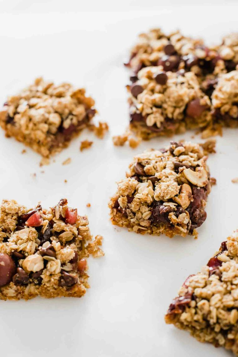 Chocolate Cherry Crumble Dessert Bars on a white surface.