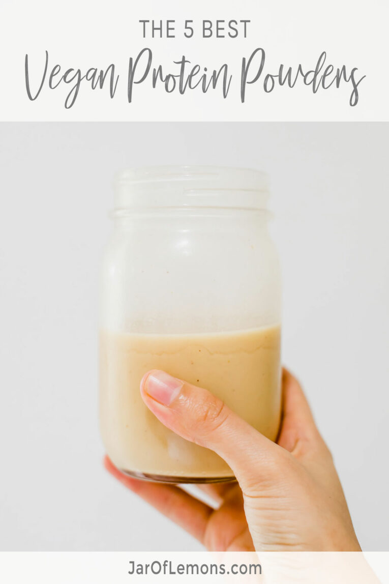 The 5 Best Vegan Protein Powders text with an image of person holding drink a mason jar.
