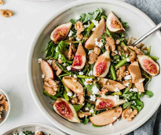 Fig & Goat Cheese Salad in a bowl with a fork.