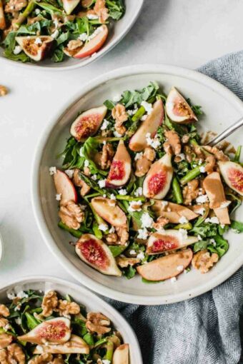 Fig & Goat Cheese Salad in a bowl with a fork.