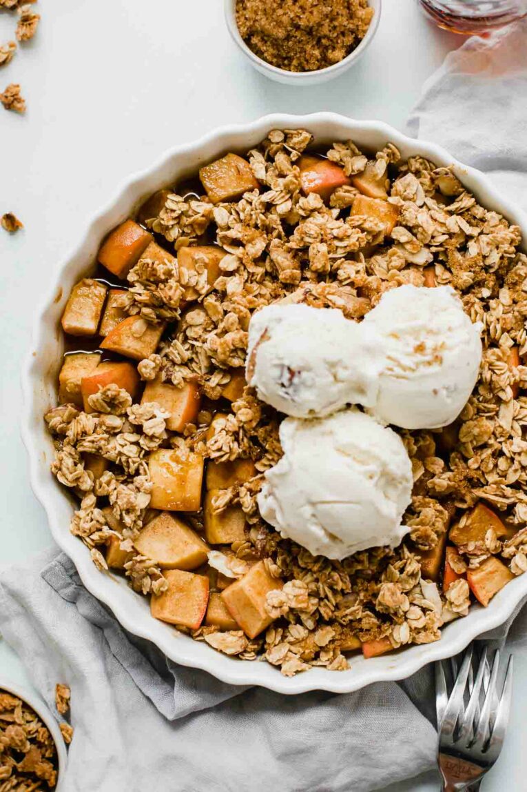 Close up of Healthy Apple Crisp topped with ice cream.