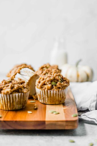 Healthy pumpkin muffins as a fall brunch idea on a cutting board.